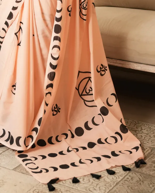 Peach_Cotton_Crescent_Om_H_Block_Print_Mul_Saree_With_Tassels_For_Women